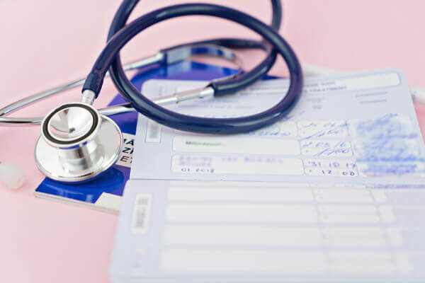 Stethoscope and pet passport with stamps about vaccinations.